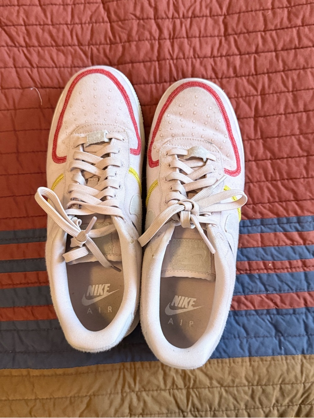 Nike Women’s Low-Top Sneakers in White with Red and Yellow Accents